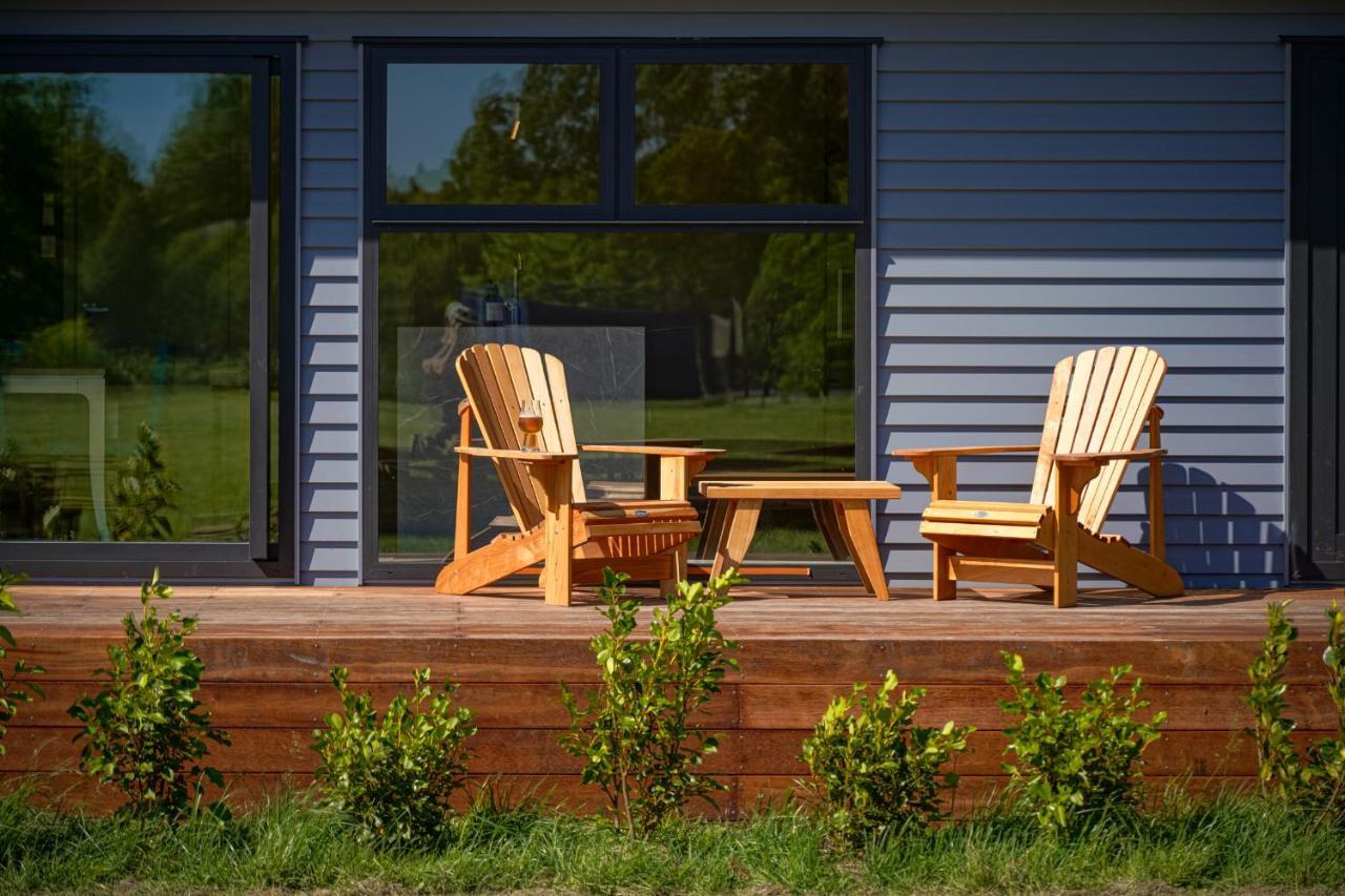 Parehua Resort Martinborough Bagian luar foto A deck with A-frame chairs